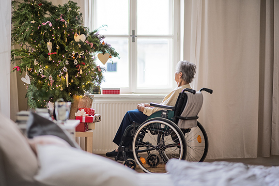 Older Woman Looking out Window